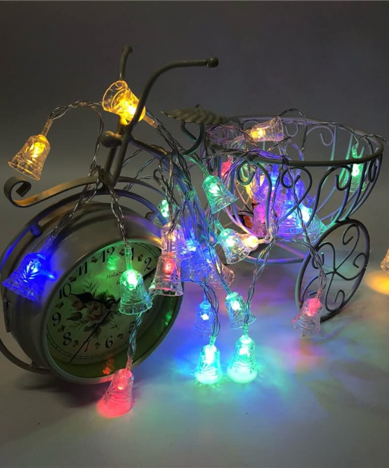 A clock with a glowing bell and a bicycle.