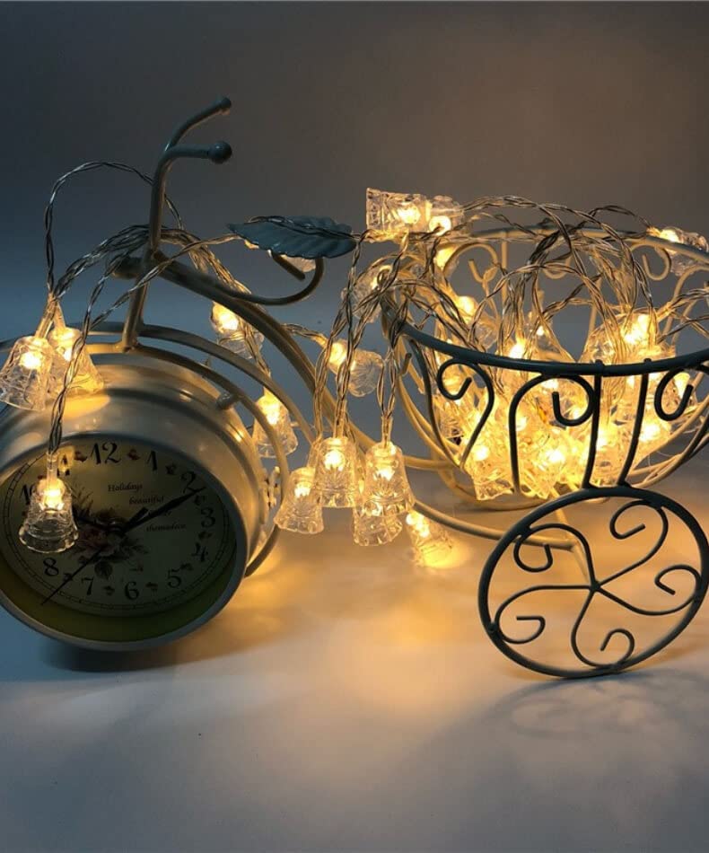 A clock and a basket with lights on it, perfect for adding a cozy touch to any room decor.
