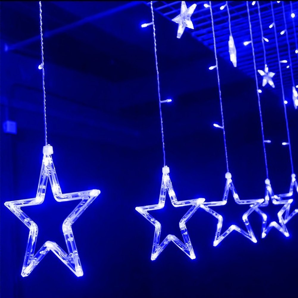  Decorative blue star curtain adorned with sparkling lights, creating a whimsical ambiance.