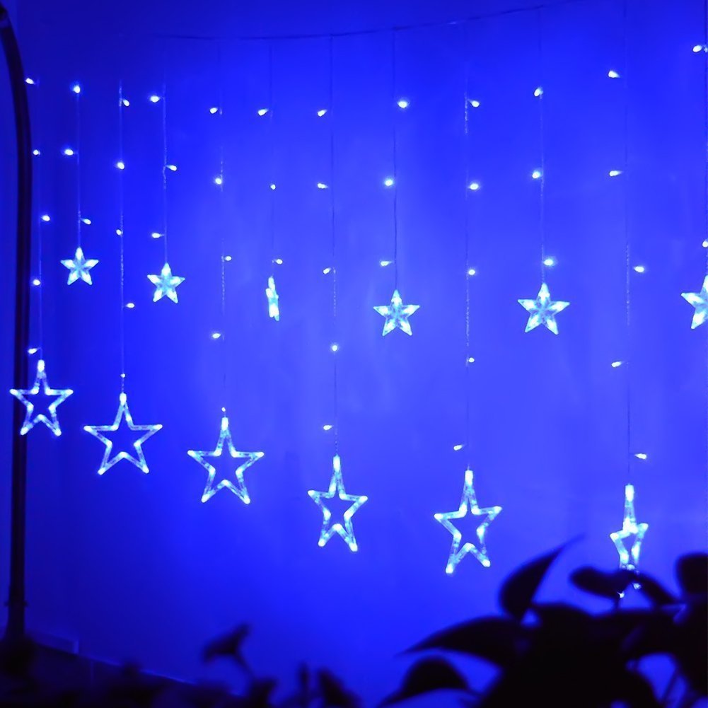 Add a touch of enchantment to your room with a blue star curtain illuminated by twinkling lights.