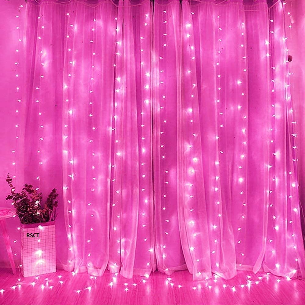 Elegant pink curtain with glowing lights.