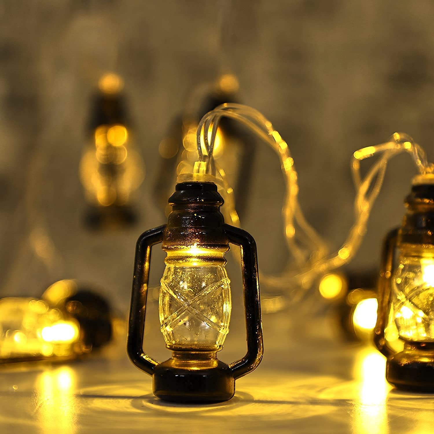 String of lights with lantern and light bulb, creating a warm and cozy ambiance in a dark room.