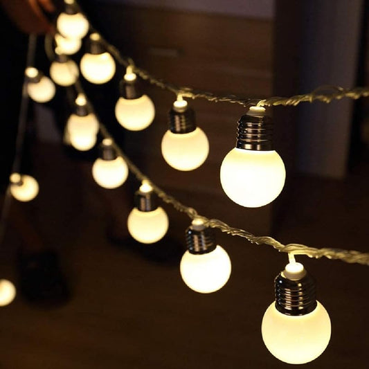 White bulbs and lights on a string, creating a warm and cozy atmosphere.