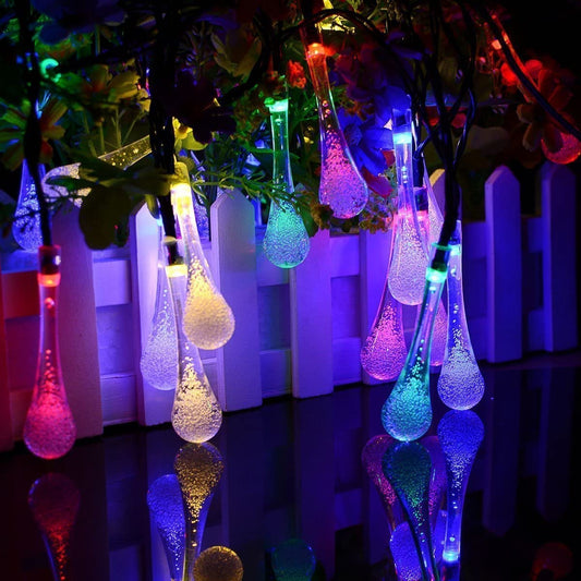  Solar LED light string lights shining brightly in the dark night sky.