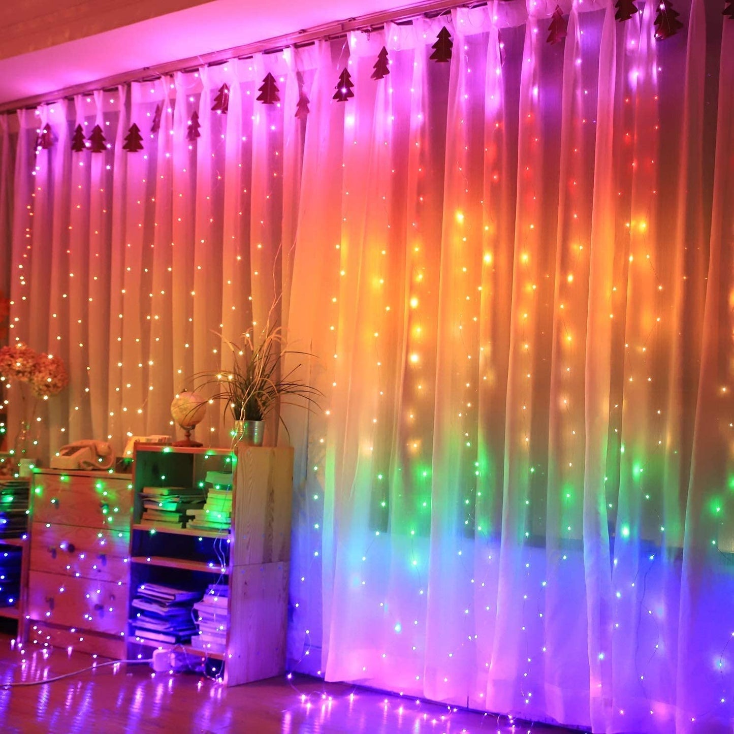 Colorful lights illuminate the room's curtains, creating a vibrant and cozy atmosphere.