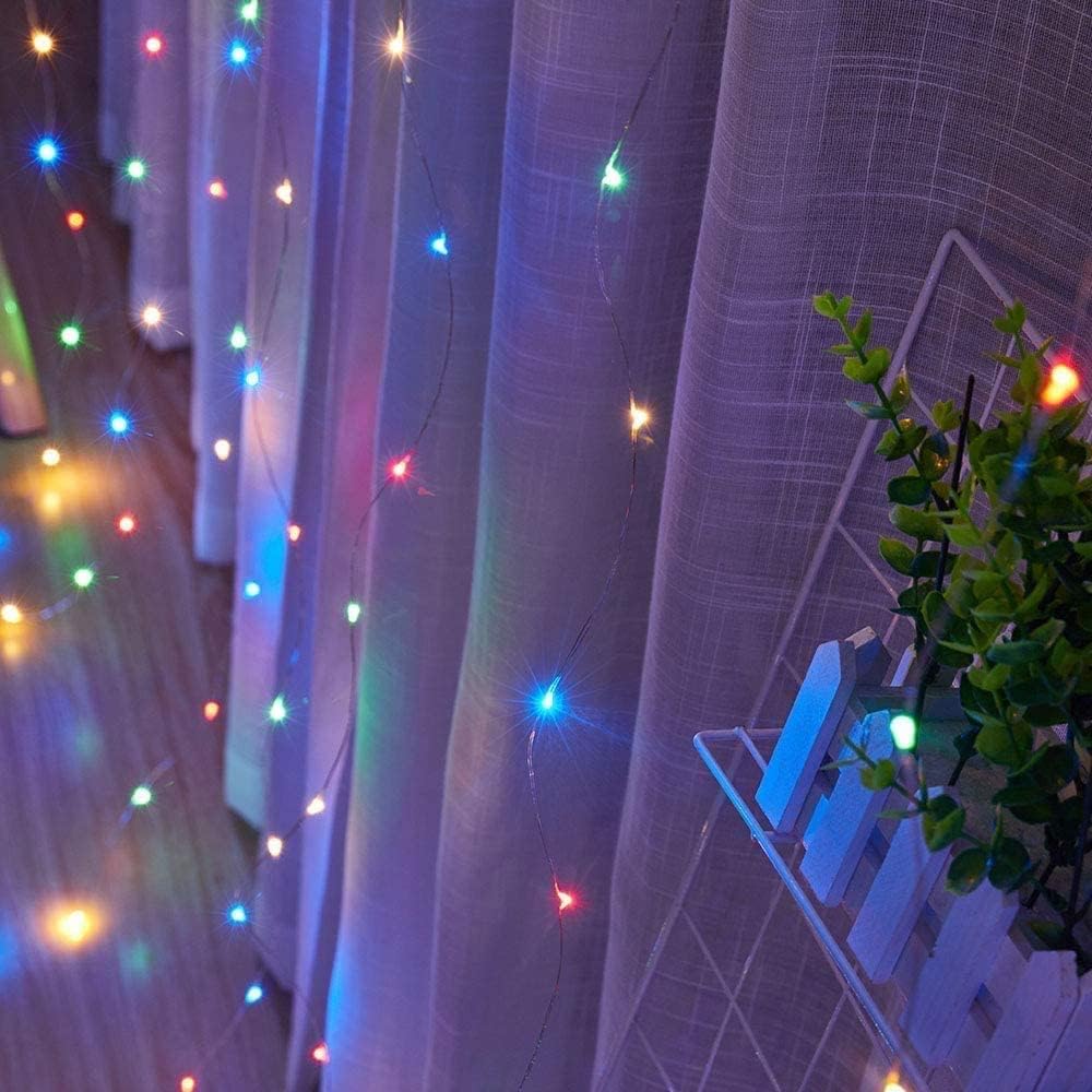  Brightly colored lights casting a glow on curtains.