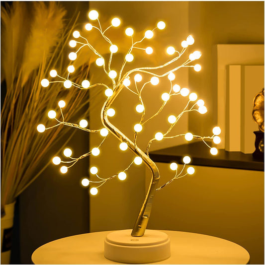 A small tree adorned with twinkling lights, adding a festive touch to any space.