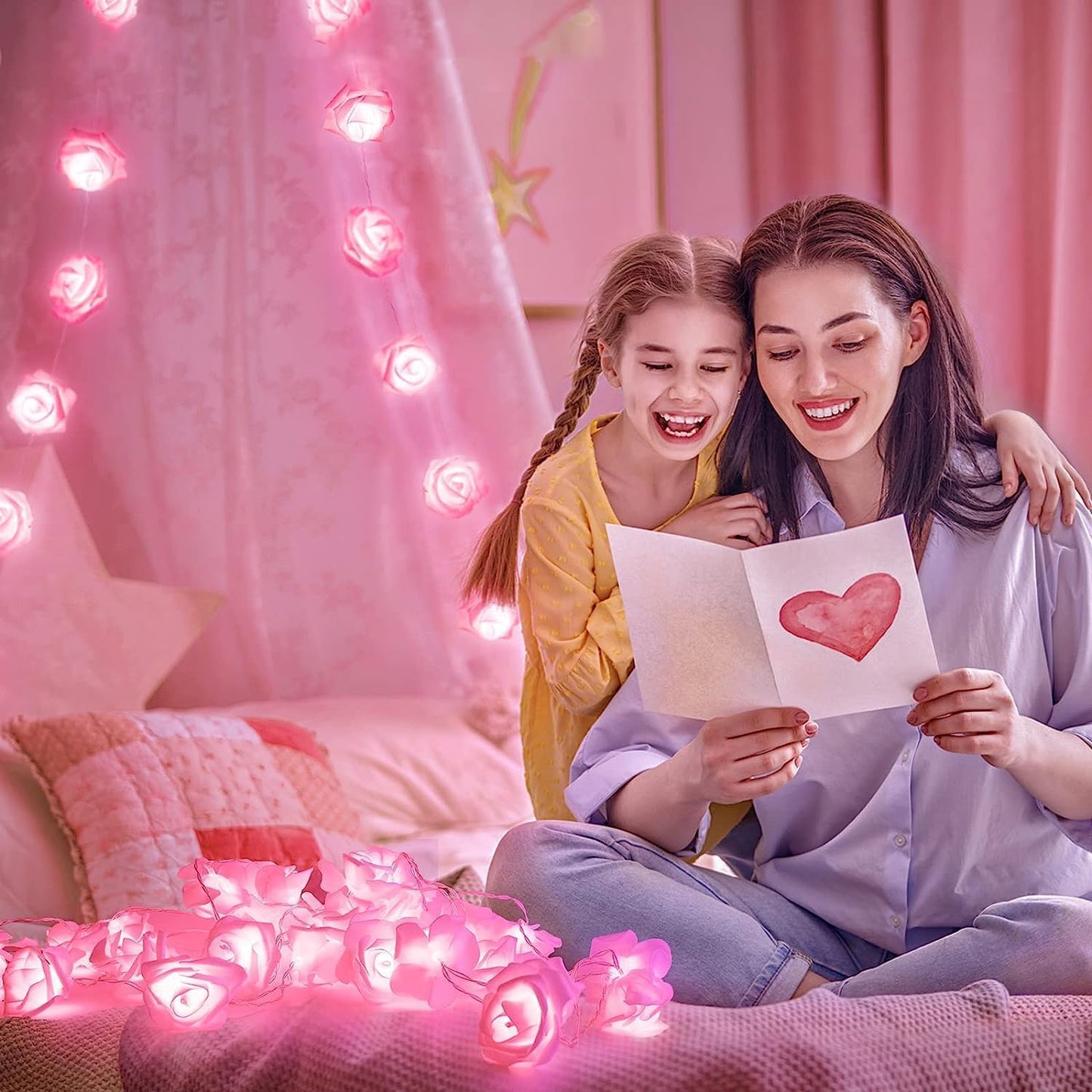 Mother and daughter enjoying a peaceful moment on a bed illuminated by soft pink lights.