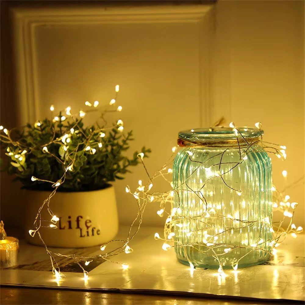 Soft white LED fairy lights elegantly draped across a table, adding a magical touch to the setting.