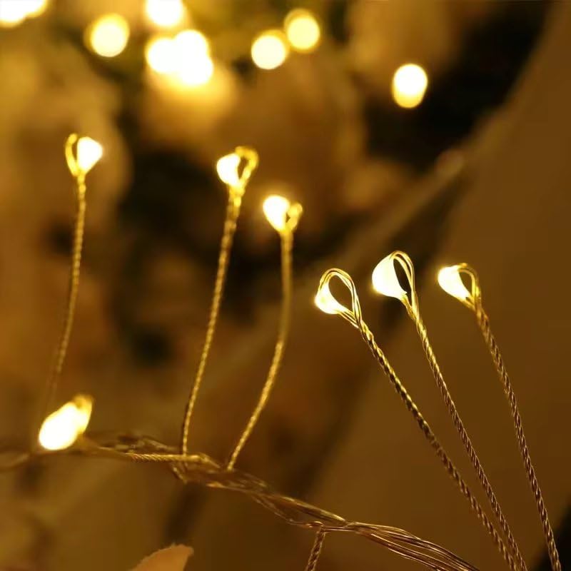  A branch adorned with a cluster of small, twinkling lights, creating a warm and inviting atmosphere.