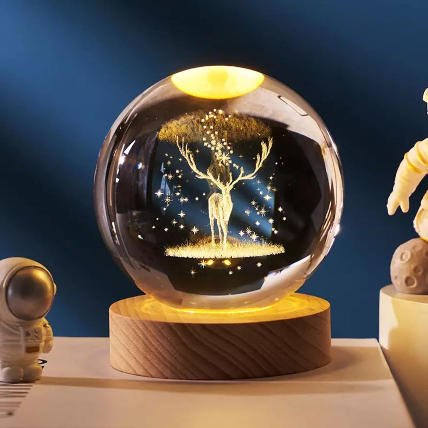 A glass ball containing a delicate deer, showcasing a whimsical and enchanting scene within its transparent surface.