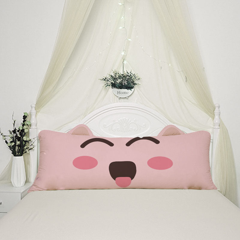 A pink pillow with a cute cat face on it, adding a touch of charm and coziness to any space.