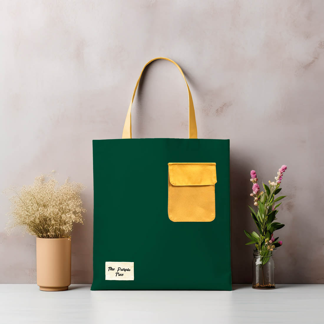 A stylish tote bag with a green and yellow design, featuring a convenient yellow pocket. Perfect for carrying your essentials!