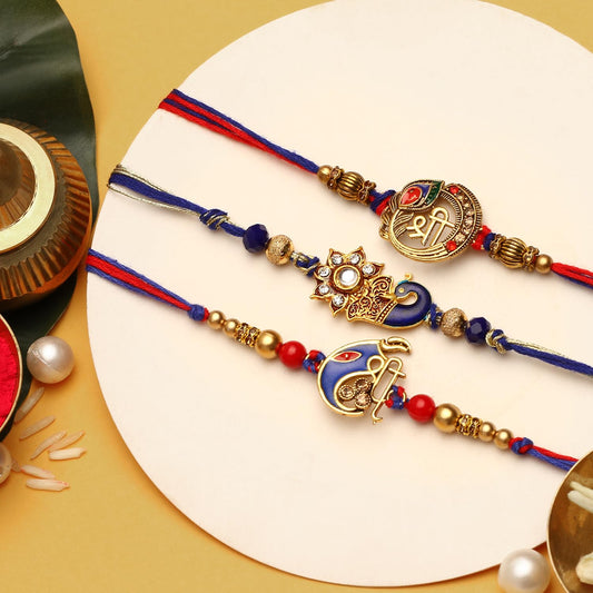 Three rakhi with gold and silver beads on a white background.