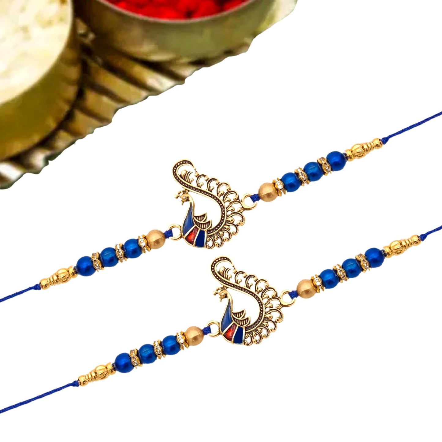 Pair of blue rakhi adorned with gold beads, representing the bond between siblings.