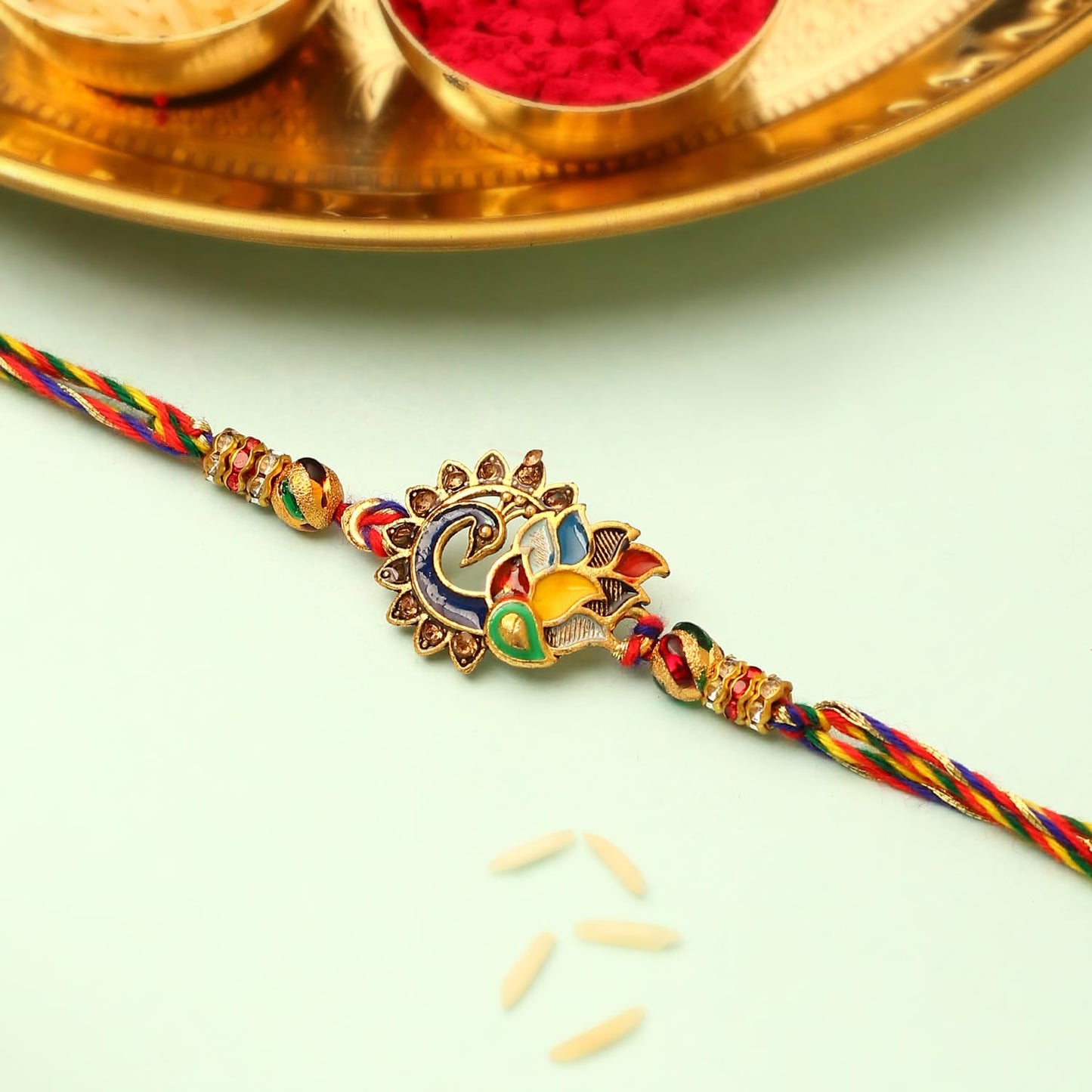 Rakhi with gold and red thread, a colorful and traditional symbol of the special bond shared between brothers and sisters during Raksha Bandhan.