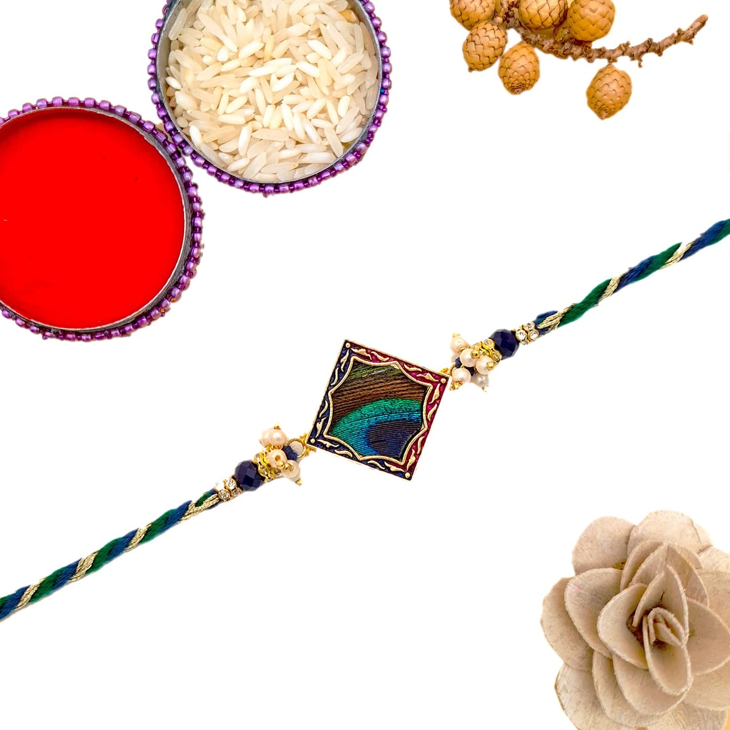 Traditional rakhi with a gold and blue bead, a colorful accessory exchanged between siblings on Raksha Bandhan.