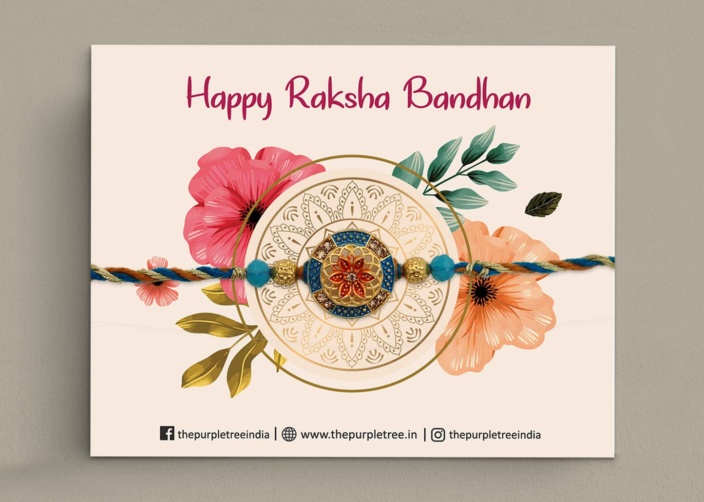 A gold and blue rakhi with a delicate flower design, representing the bond between siblings.