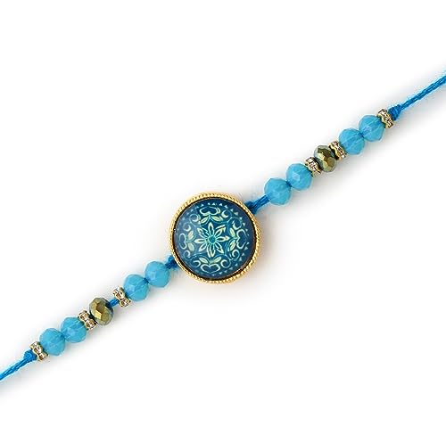 Elegant blue beaded Rakhi with gold charm.