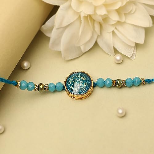 Fashionable blue and white bracelet with a dazzling blue stone, a must-have piece for your jewelry box.