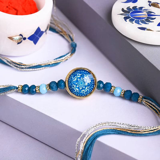 Blue and gold bracelet with a stunning blue stone, perfect for adding a touch of elegance to any outfit.