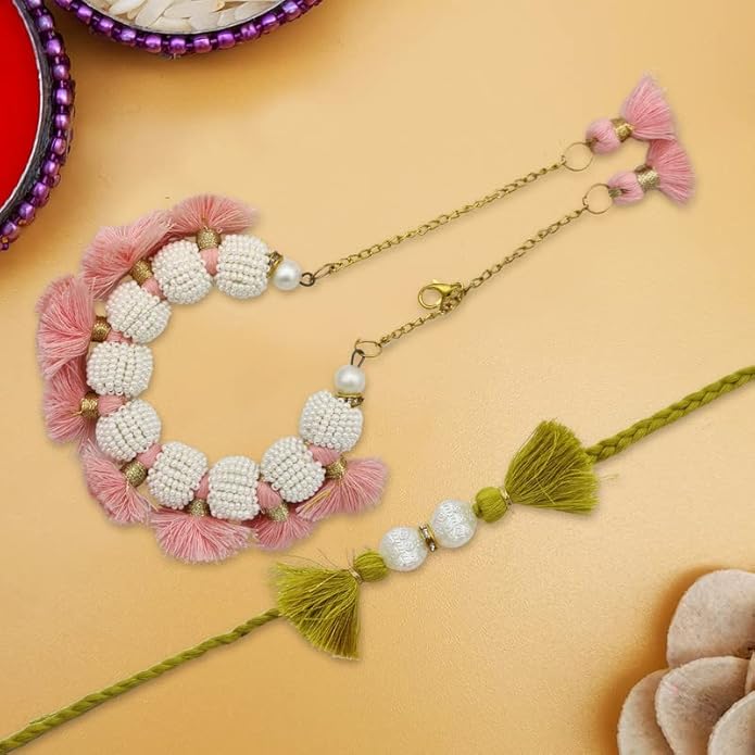 Traditional Raksha Bandhan rakhi in pink and green colors with beads and tassels.