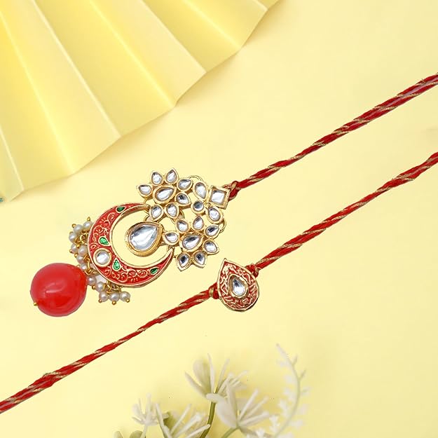 Two red and white rakhi with gold and white stones, perfect for bhaiya bhabhi rakhi celebration.