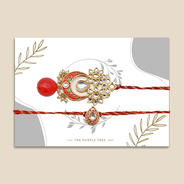 Pair of elegant red and white rakhi adorned with gold and white stones, ideal for bhaiya bhabhi rakhi.