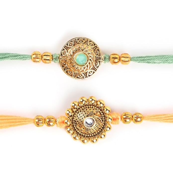  Two beautifully crafted rakhi bracelets in gold and green threads, showcasing the festive spirit of sibling relationships.