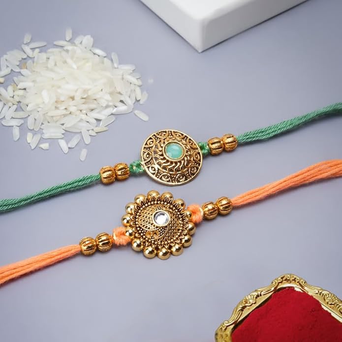 Two colorful beaded rakhi bracelets with gold thread. Traditional Indian festival symbol of sibling bond.