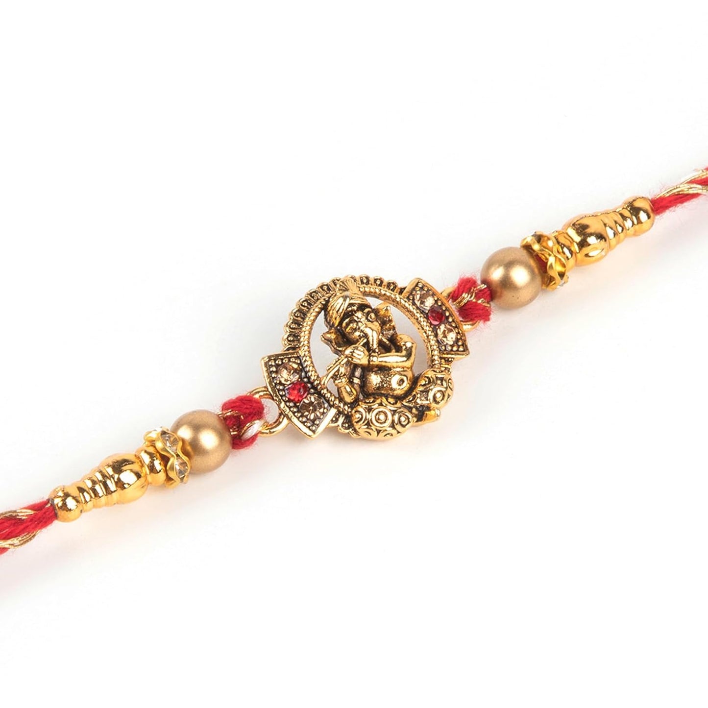 Red and gold rakhi, a sacred thread exchanged during the festival of Raksha Bandhan.