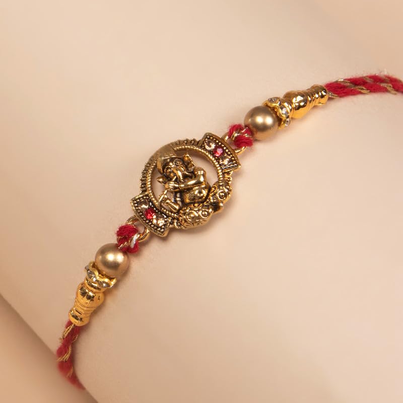 Red and gold rakhi, a sacred thread exchanged during the festival of Raksha Bandhan.