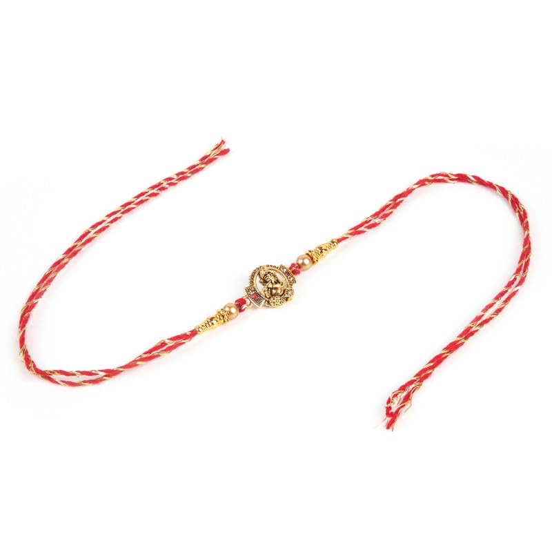 A red and gold rakhi bracelet with a gold coin, symbolizing love and protection.