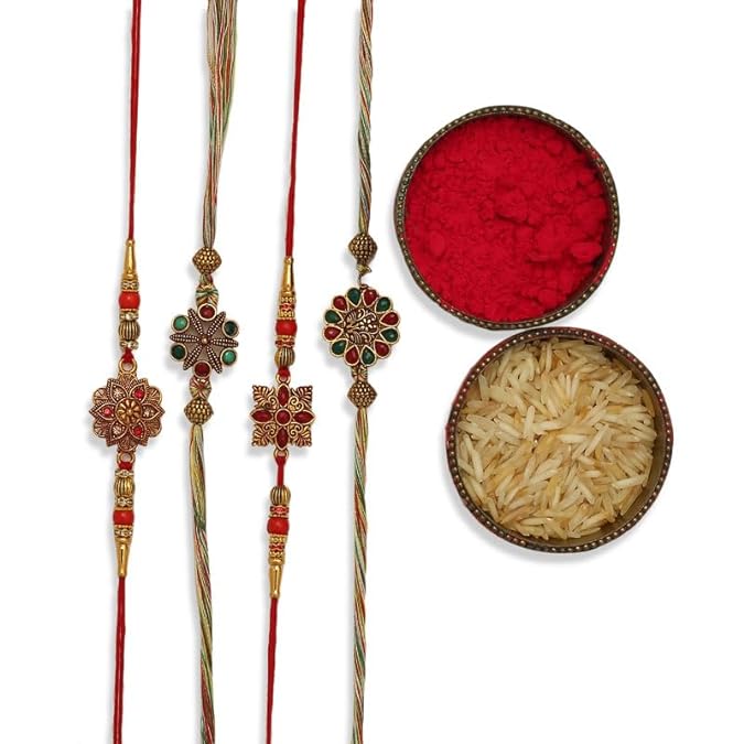 Four vibrant rakhi's with gold and green beads, symbolizing love and protection, accompanied by vermilion and a bowl of rice.