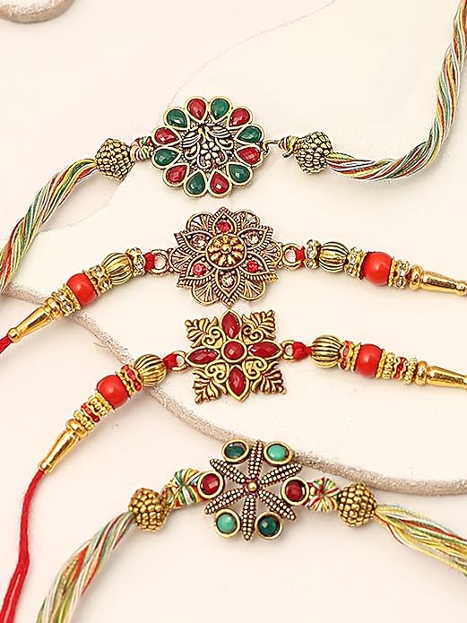  Vibrant rakhi's in Four different colors adorned with gold and green beads, symbolizing love and protection.