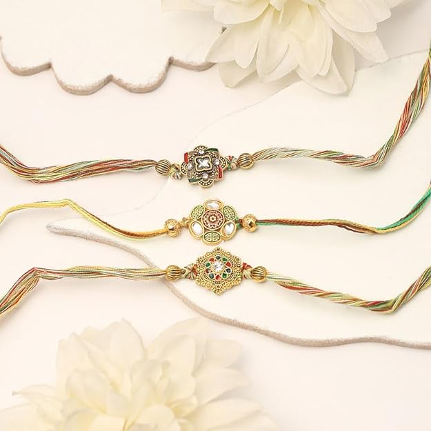 Three colorful rakhi's with a beautiful flower design. Perfect for celebrating the bond of love and protection.