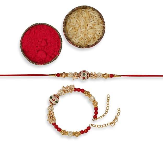 Red and gold rakhi with a gold chain with a vermilion and a bowl of rice, symbolizing the festive celebration of Raksha Bandhan.