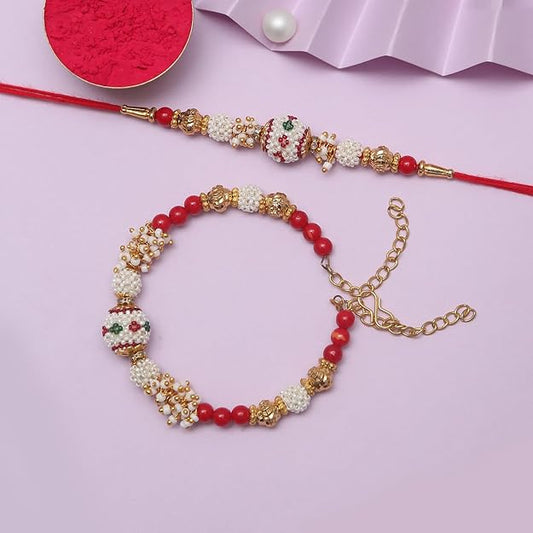 Red and white rakhi  featuring pearls, a symbol of sibling relationship.