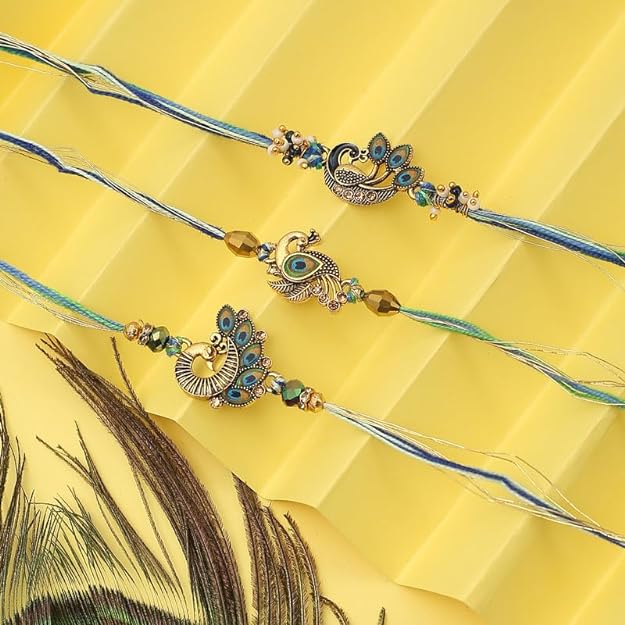 Three colorful rakhi's with beautiful peacock designs, perfect for celebrating the bond of love and protection.