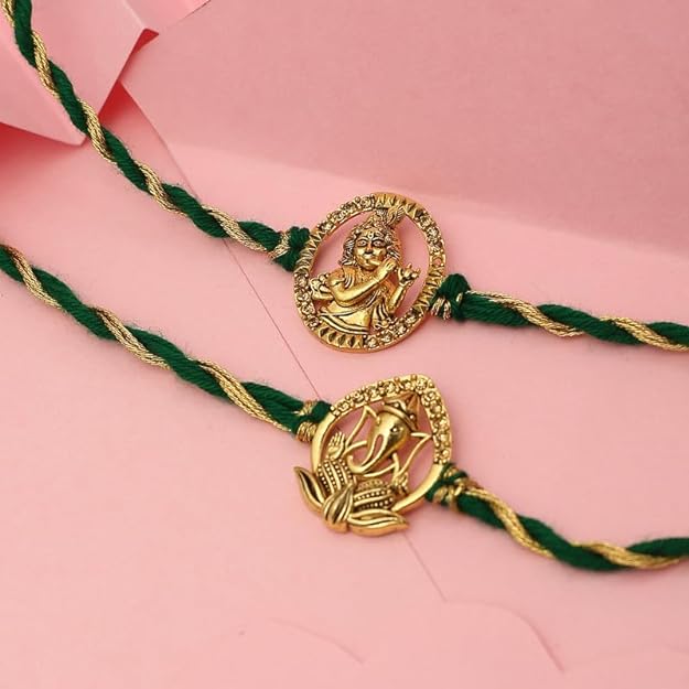 Pair of elegant gold plated rakhi with green thread, ideal for the festive occasion.