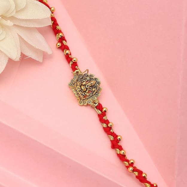 Red and gold bracelet featuring a lovely flower design