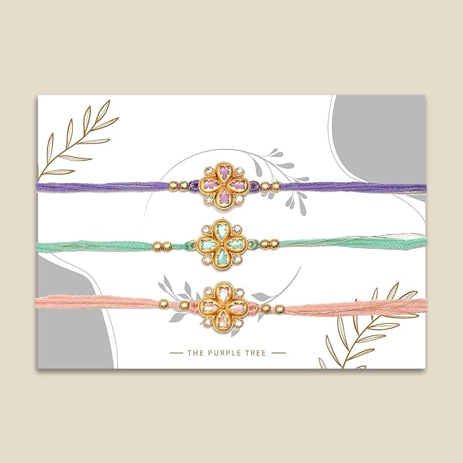 Vibrant rakhi's in three different colors, adorned with gold thread for Raksha Bandhan.