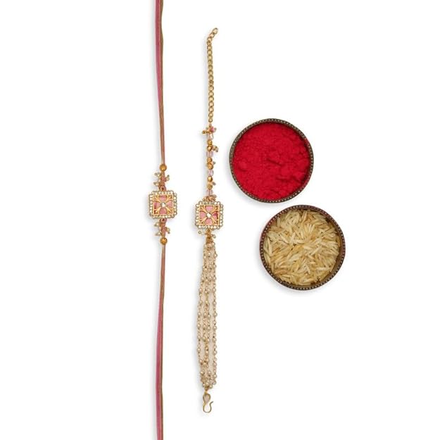 Two red rakhi's with gold thread and a bowl - a traditional symbol of love and protection during the festival of Raksha Bandhan.