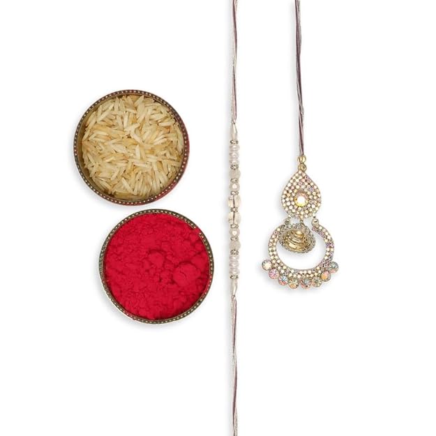 Festive gold rakhi and vibrant red powder for celebration.