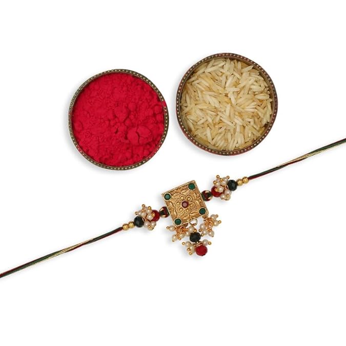  red rakhi and a bowl of rice with vermilion.