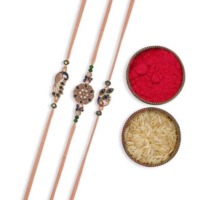 Three colorful rakhi with accompanied by vermilion and a bowl of rice.