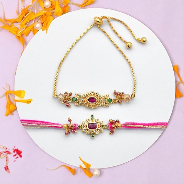 Two gold Rakhi with pink and yellow flowers, perfect for adding a touch of elegance to any outfit.