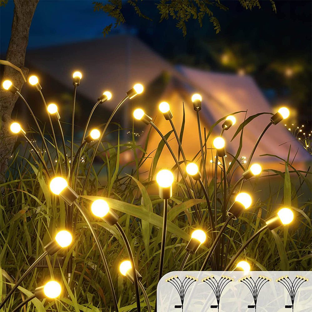 A cluster of garden lights illuminating a peaceful outdoor space.