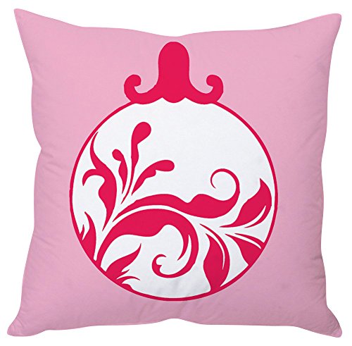 A soft pink pillow adorned with a vibrant red ornament resting on its surface.

