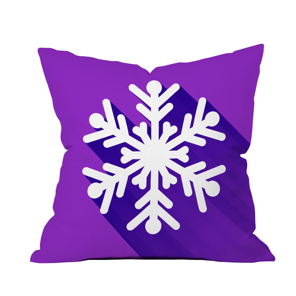 Purple pillow featuring a white snowflake design, adding a touch of winter charm to any decor.

